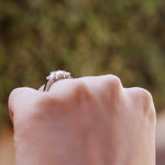 Dyla 2.5 ct emerald trilogy ring in sterling silver, showcasing a stunning design perfect for engagements or promises.