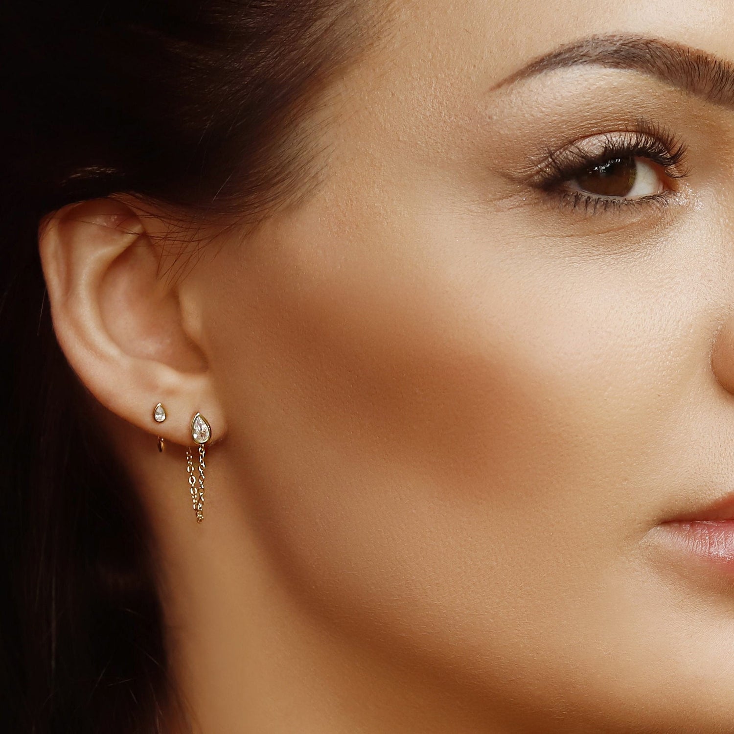 Sterling silver huggie hoop earrings by AJJ, delicate open minimalist silver earrings with a simple pull design.