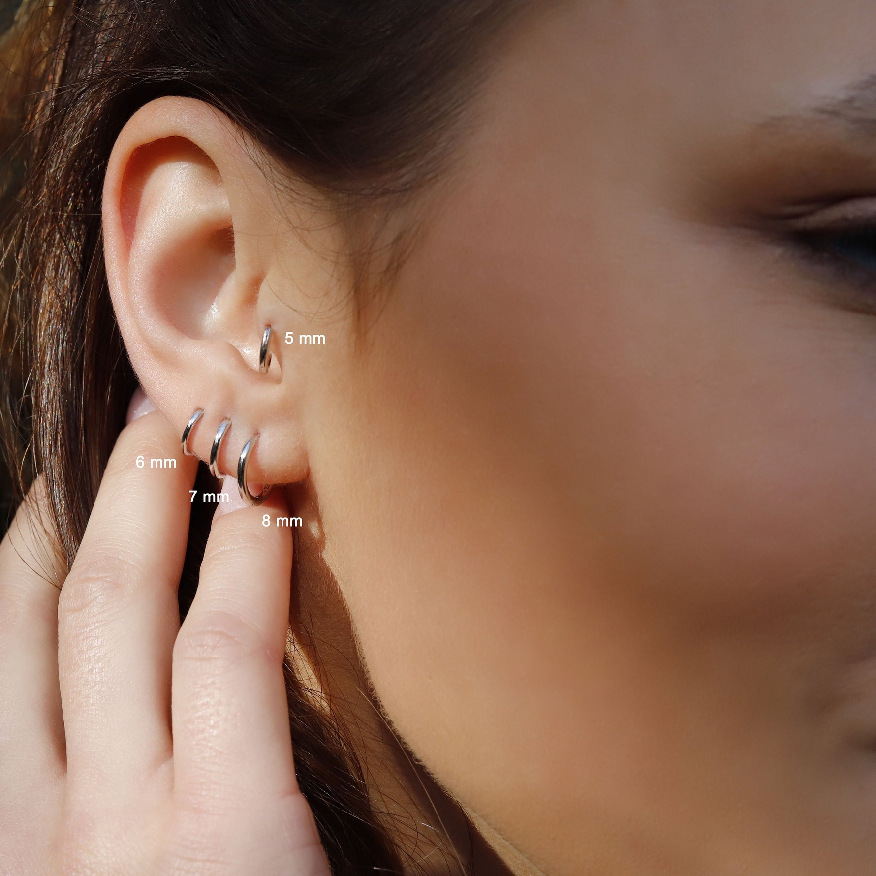 AJJ sterling silver huggie hoop earrings with a delicate open geometric design, minimalist silver earrings for everyday wear