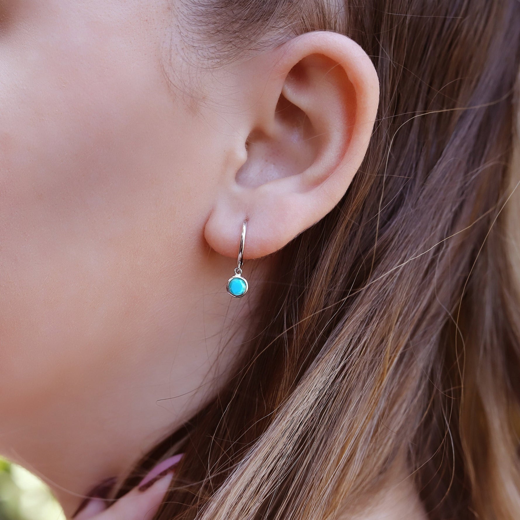 AJJ gold turquoise cartilage hoop earring with small hoop design, suitable for helix, tragus, and cartilage piercings.