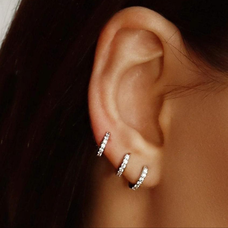 Small gold huggie hoop earrings set with cubic zirconia, minimalist sterling silver hoops with pave detailing by AJJ