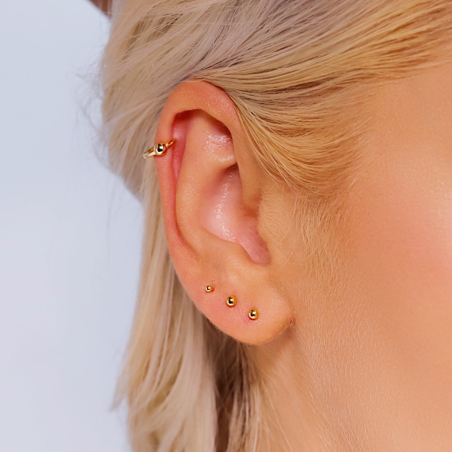 Tiny 18K gold ball stud earrings by AJJ, 1.5mm to 3mm, delicate dainty jewelry perfect for everyday wear or gifting.