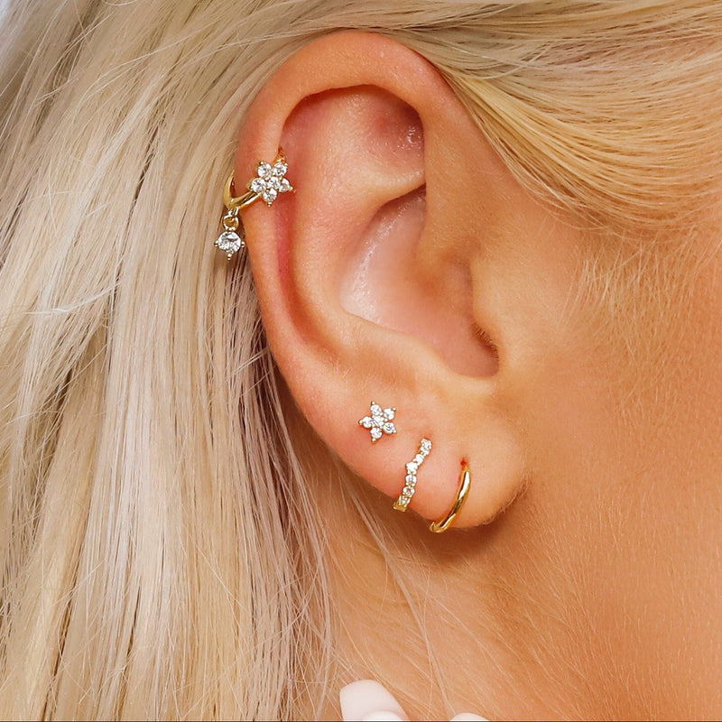 AJJ Becky huggie hoop earrings in gold and silver with a helix design, small cartilage hoop jewelry for pierced ears.