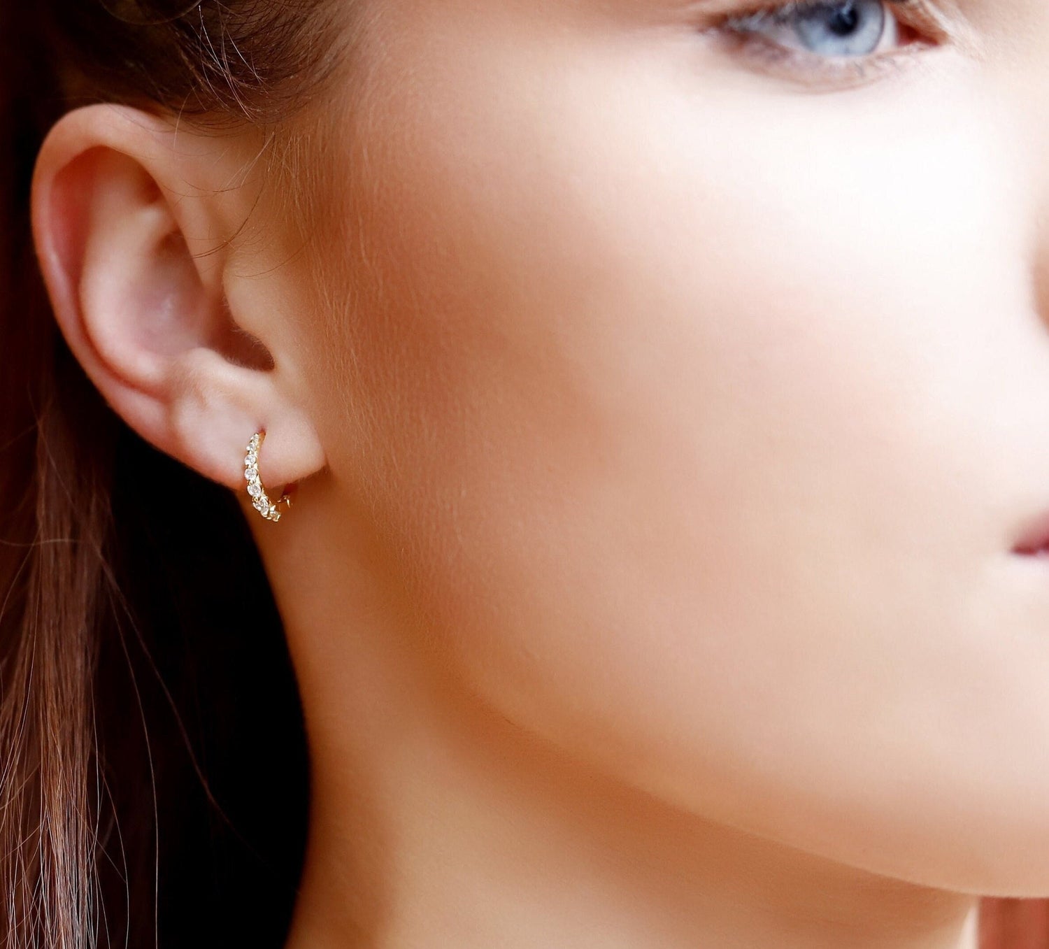 Small gold huggie hoop earrings set with cubic zirconia pave accents, minimalist sterling silver jewelry by AJJ