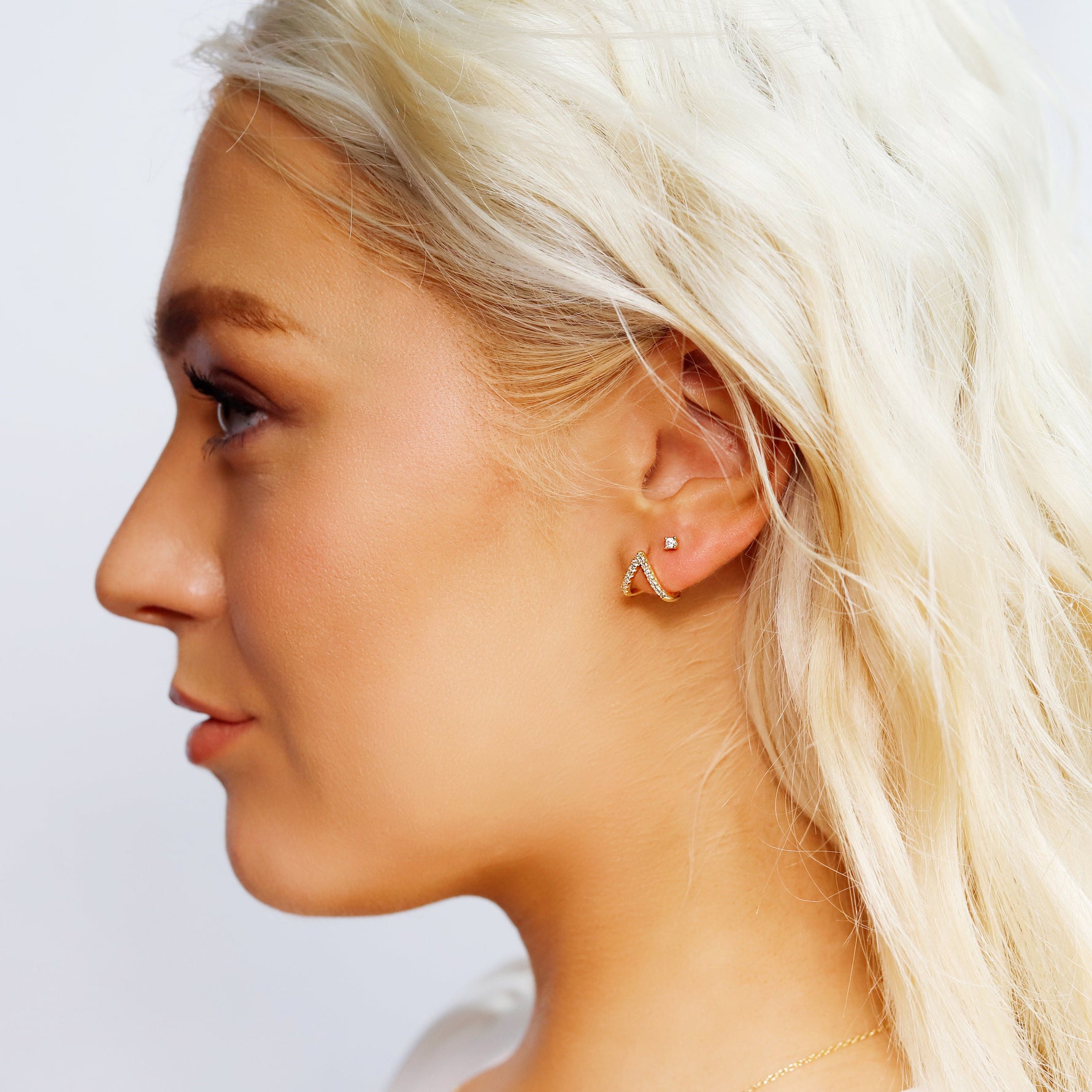 Sterling silver and gold minimalist stud earrings with geometric design, dainty and simple jewelry for women.